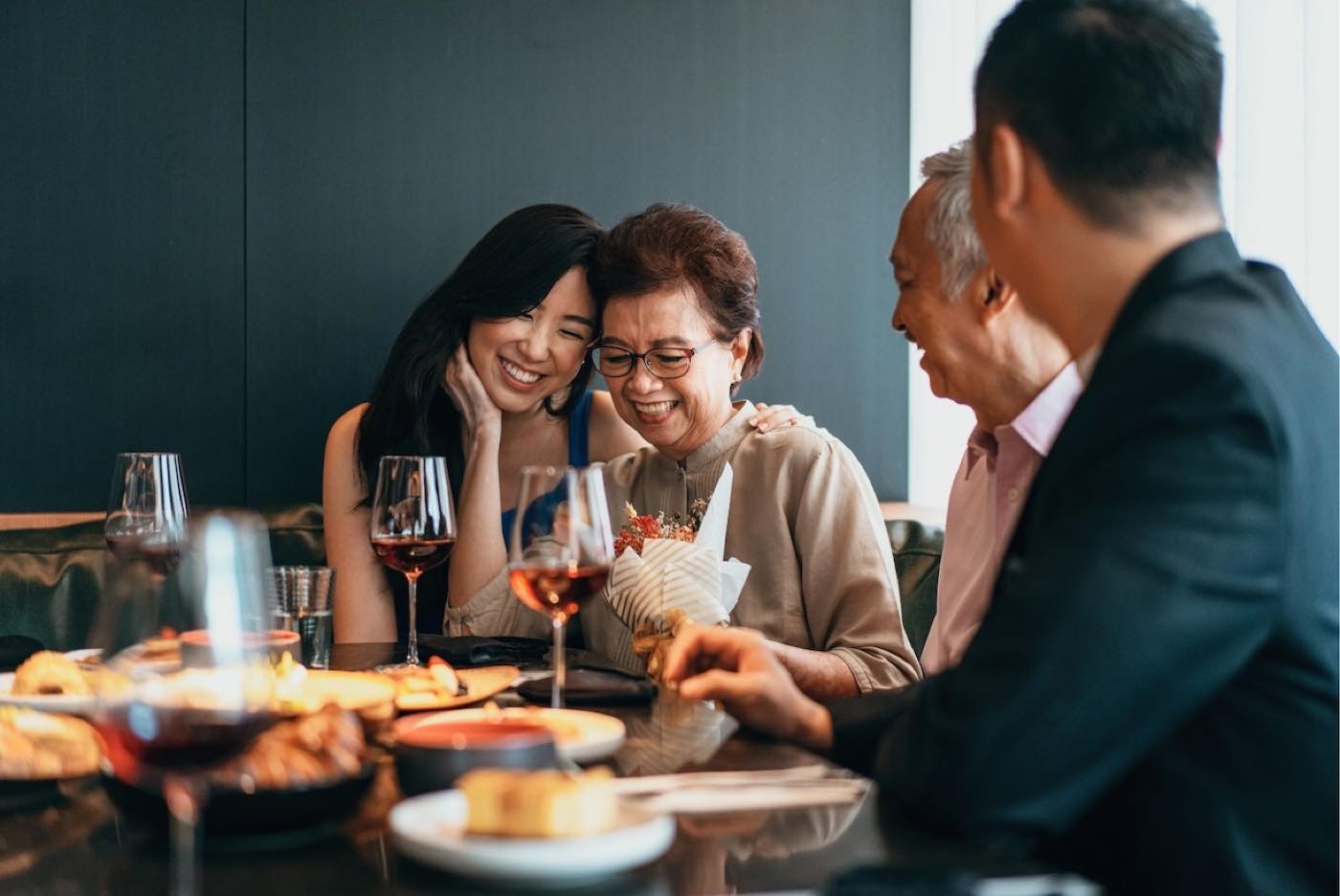A family sharing a meal together at a local restaurant
